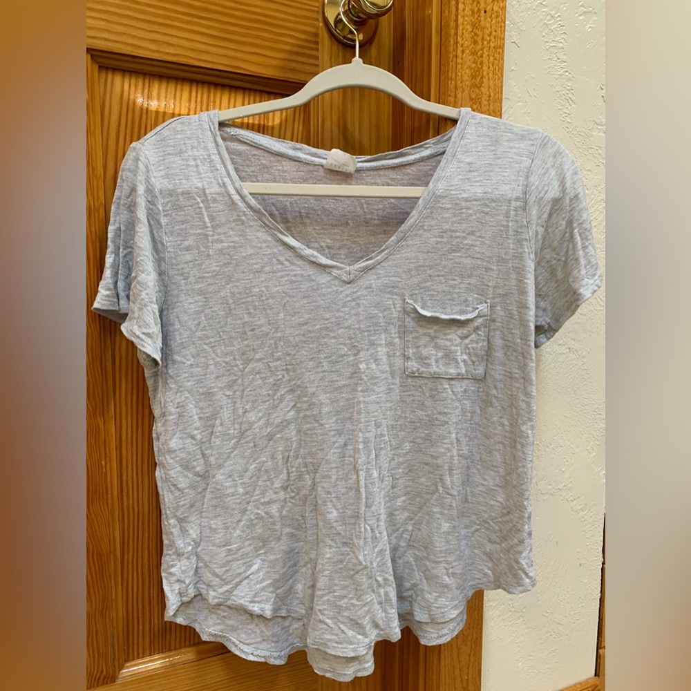 gray V-neck shirt